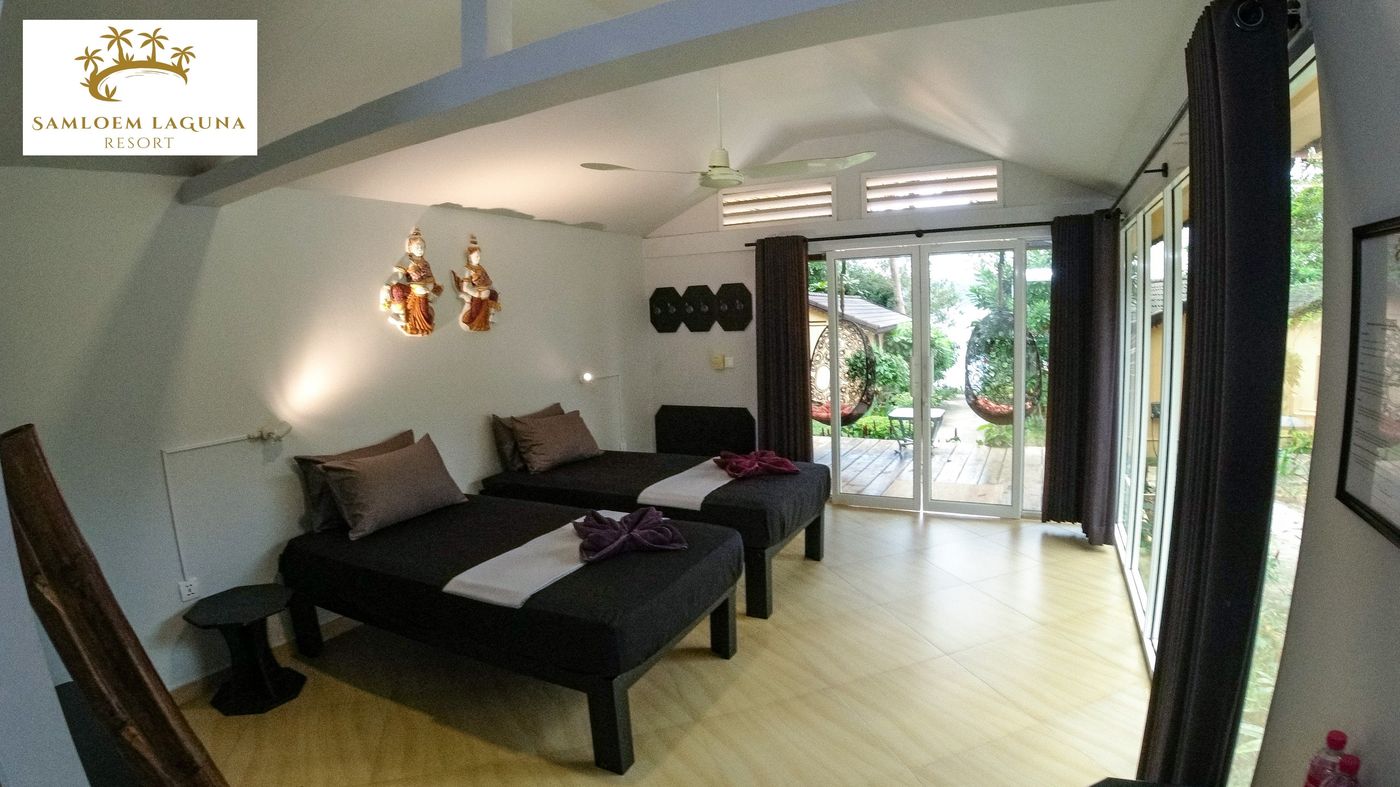 Twin room interior with natural light and comfortable furnishings