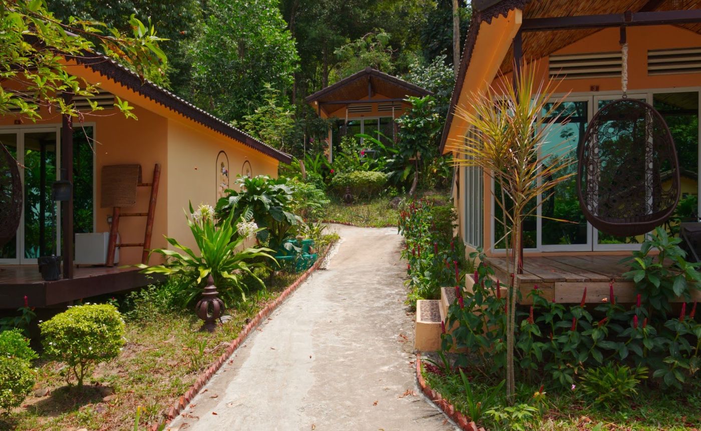 Pathway between villas and landscaped accommodation buildings