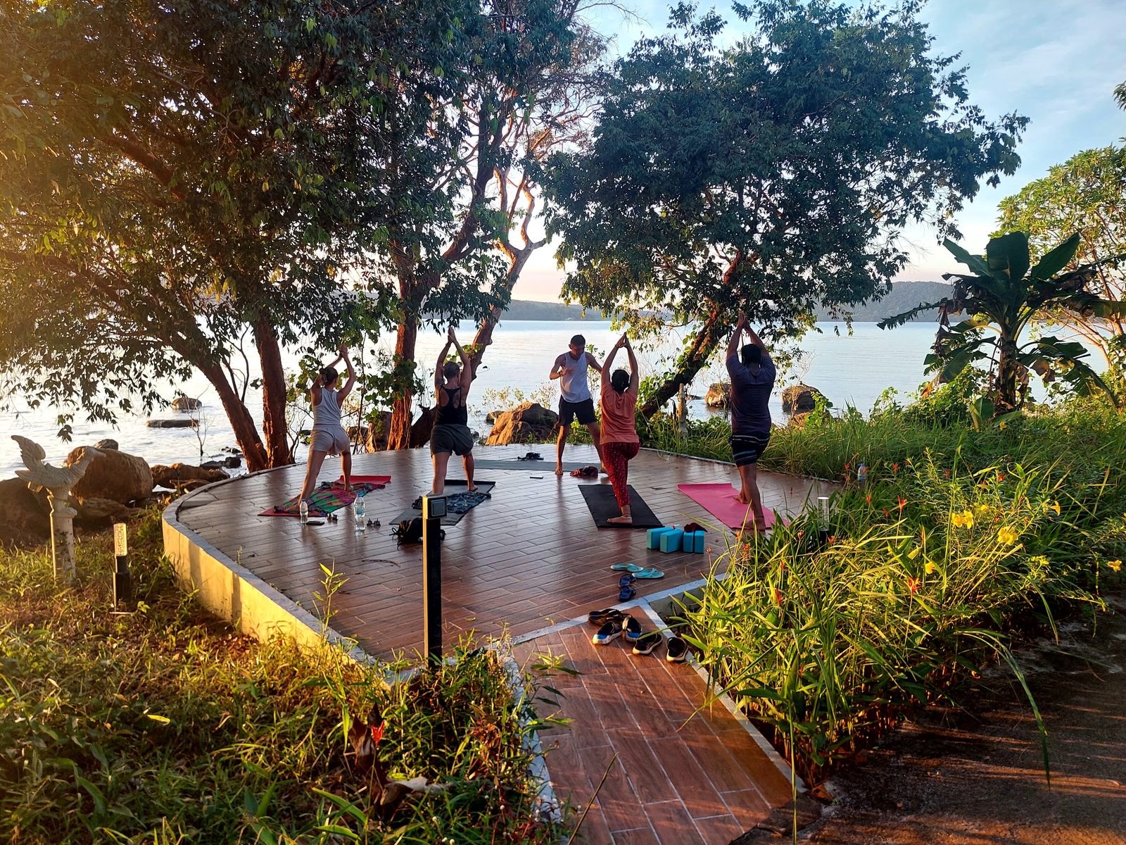 Morning yoga on a deck facing the water